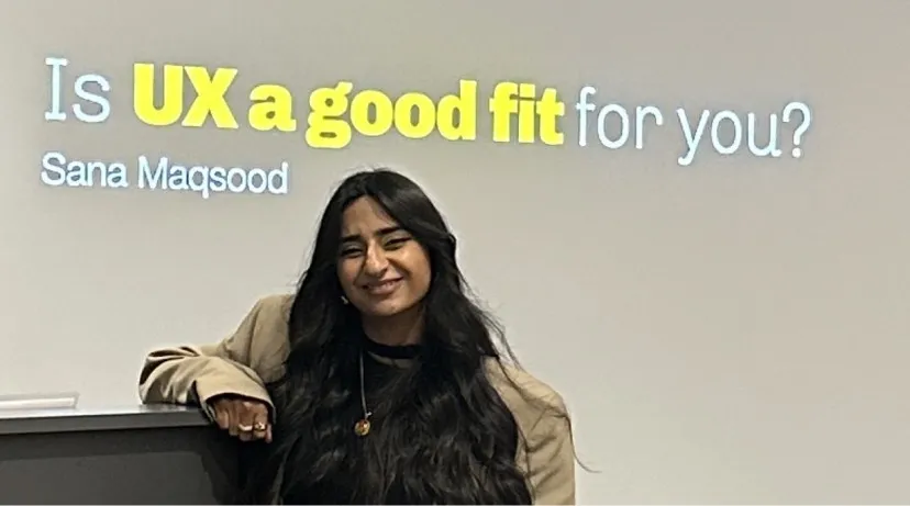 Sana in front of her talk slide, “Is UX a good fit for you?”