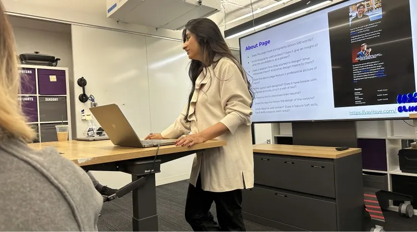 Sana presenting from a standing desk