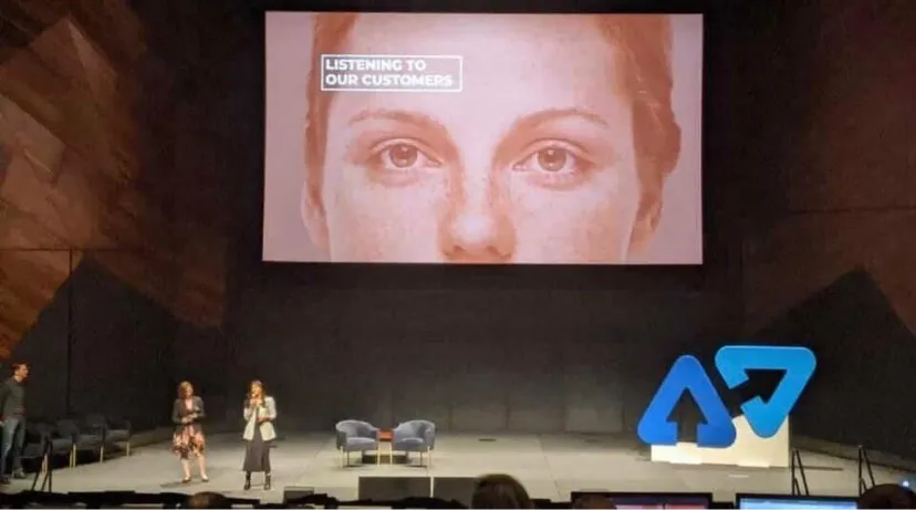 Speakers on a conference stage